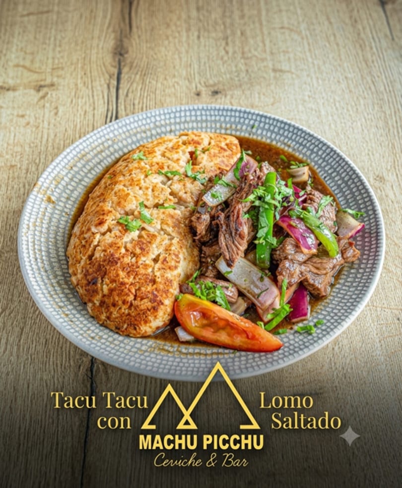 Peruvian Tacu Tacu con Lomo Saltado, a dish with rice and beans, beef, onions, and tomatoes.