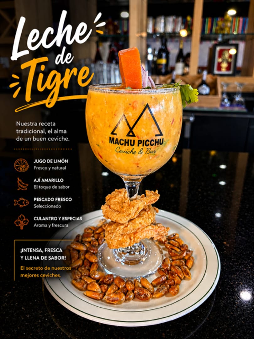 Leche de Tigre ceviche cocktail from Machu Picchu Ceviche & Bar, garnished with fried seafood and corn.