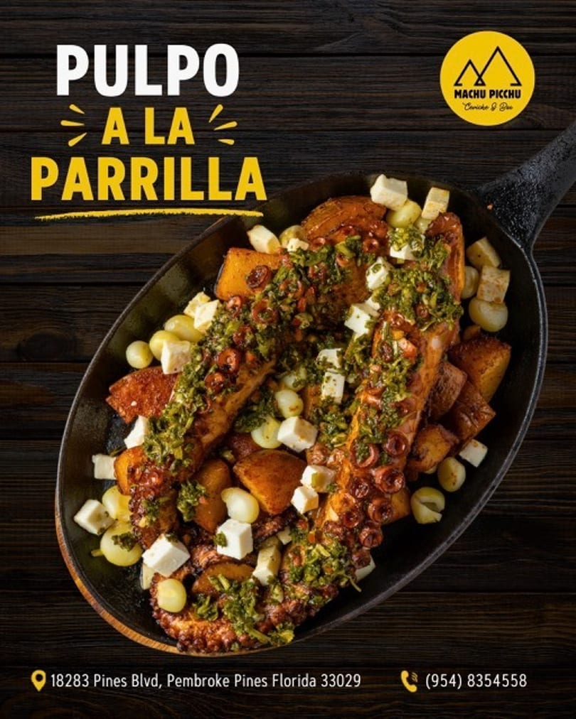 Grilled octopus with potatoes, corn, and cheese, topped with green sauce in a black skillet.